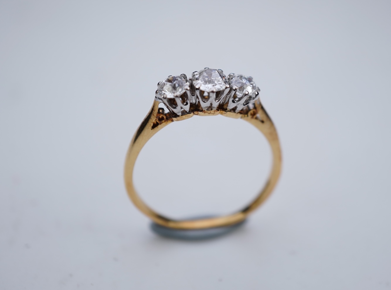 A three-stone diamond ring, early 20th century